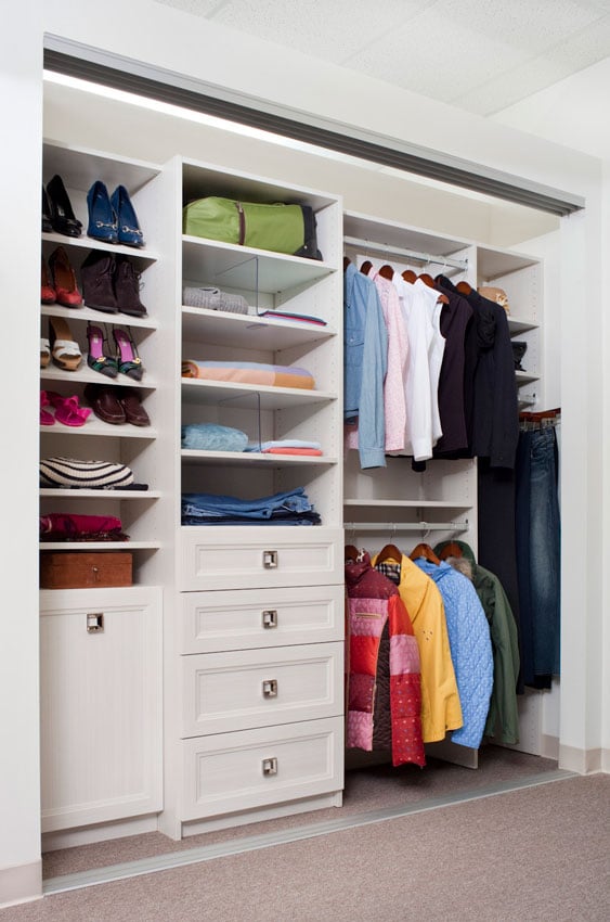 Reach in closet with double hanging, shoe shelves and pull out drawers